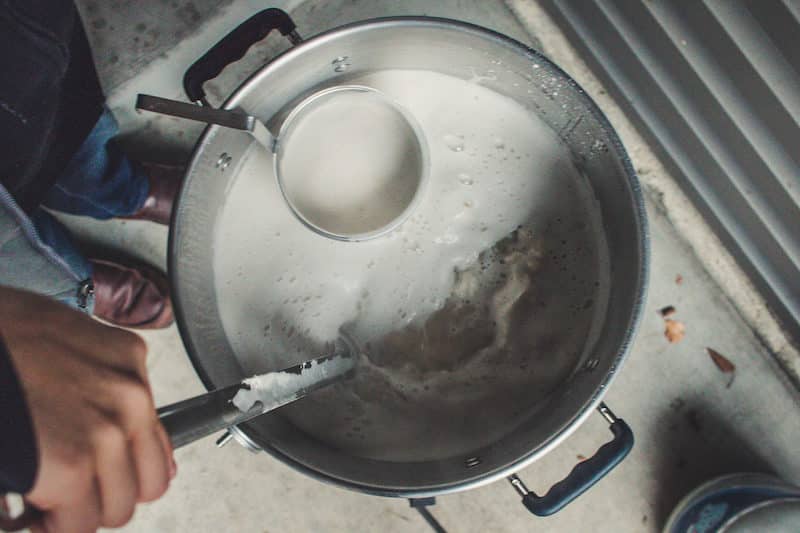 Stirring Dry Malt Extract Into Kettle